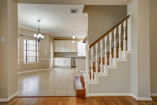 4415 April Meadow Way, Sugar Land, TX 77479 - kitchen with stainless steel dishwasher, white cabinetry, decorative backsplash, baseboards, and light wood-style flooring