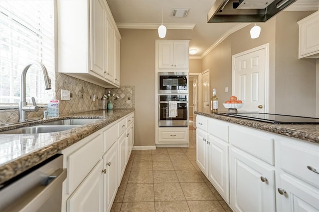 4415 April Meadow Way, Sugar Land, TX 77479 - kitchen featuring appliances with stainless steel finishes, a sink, ventilation hood, crown molding, and decorative backsplash