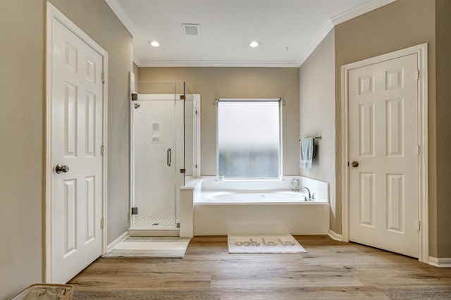 4415 April Meadow Way, Sugar Land, TX 77479 - full bathroom featuring a bath, ornamental molding, a shower stall, wood finished floors, and recessed lighting