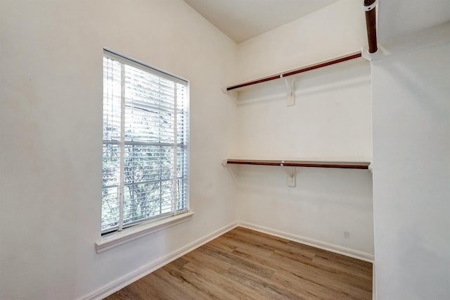 4415 April Meadow Way, Sugar Land, TX 77479 - walk in closet featuring wood finished floors