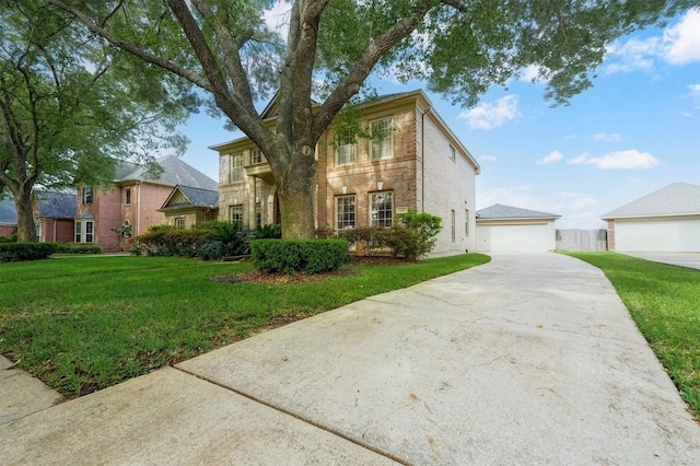 4415 April Meadow Way, Sugar Land, TX 77479 - traditional-style home with a front yard, a garage, and brick siding