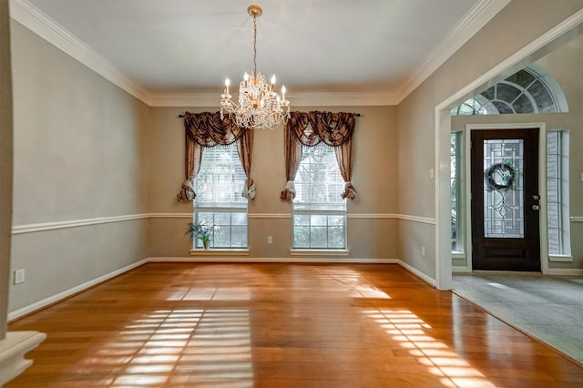 4415 April Meadow Way, Sugar Land, TX 77479 - entrance foyer featuring a chandelier, hardwood / wood-style flooring, crown molding, and baseboards