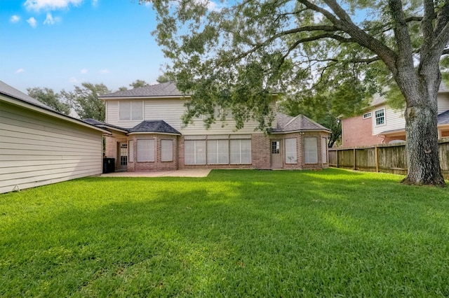 4415 April Meadow Way, Sugar Land, TX 77479 - back of property featuring a patio, brick siding, and a shingled roof