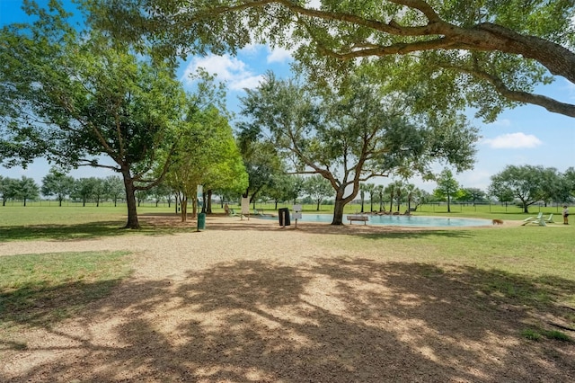 4415 April Meadow Way, Sugar Land, TX 77479 - surrounding community with a lawn and a swimming pool