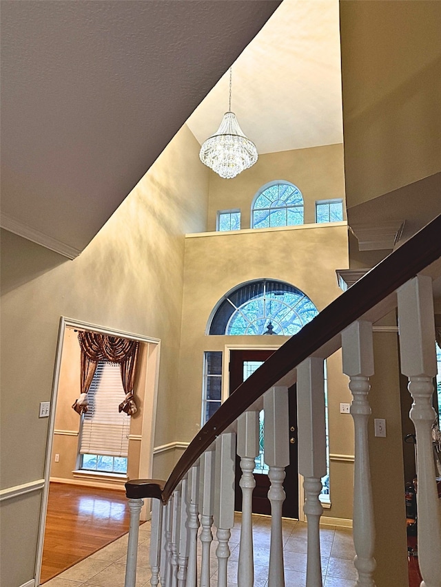 4415 April Meadow Way, Sugar Land, TX 77479 - entryway with a chandelier, baseboards, stairs, and a high ceiling