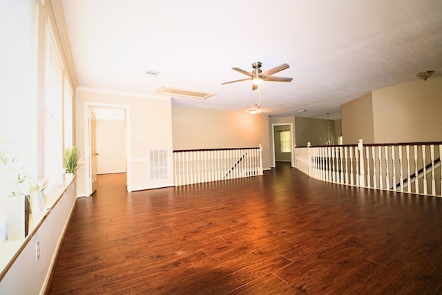 4415 April Meadow Way, Sugar Land, TX 77479 - empty room featuring wood finished floors, ceiling fan, crown molding, and attic access