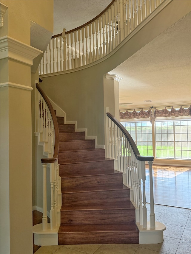 4415 April Meadow Way, Sugar Land, TX 77479 - stairway with tile patterned flooring and a high ceiling
