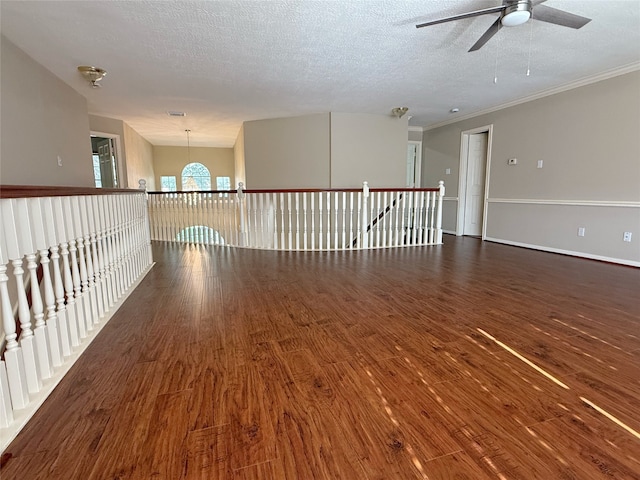 4415 April Meadow Way, Sugar Land, TX 77479 - unfurnished room featuring ceiling fan, wood finished floors, a textured ceiling, and ornamental molding