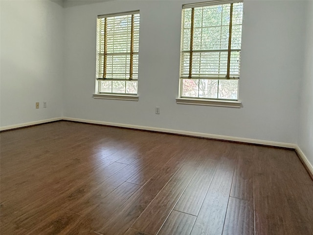 4415 April Meadow Way, Sugar Land, TX 77479 - spare room with healthy amount of natural light and dark wood finished floors