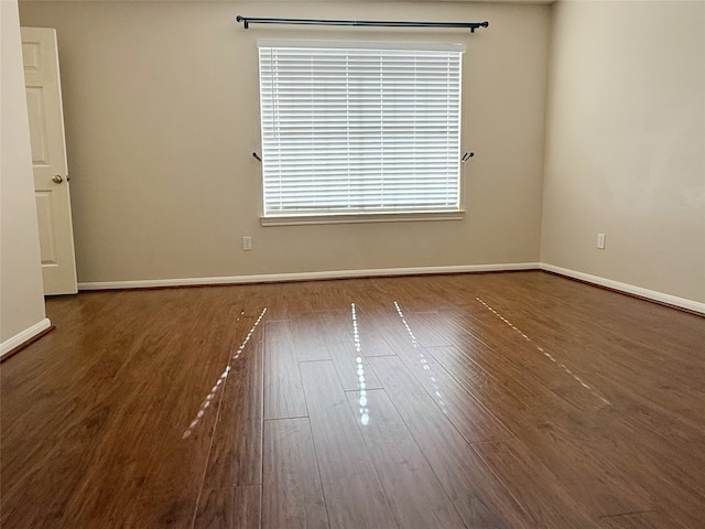 4415 April Meadow Way, Sugar Land, TX 77479 - empty room featuring wood finished floors and baseboards