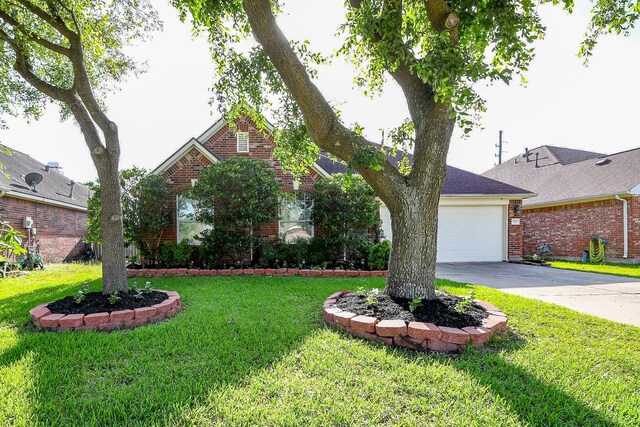16211 Fleethaven Ln, Houston, TX 77084 - view of front of house featuring brick siding, driveway, a garage, and a front lawn