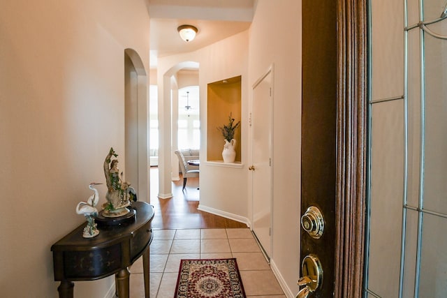 16211 Fleethaven Ln, Houston, TX 77084 - foyer with arched walkways and light tile patterned floors