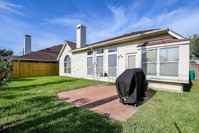 16211 Fleethaven Ln, Houston, TX 77084 - rear view of house featuring a patio area and a chimney