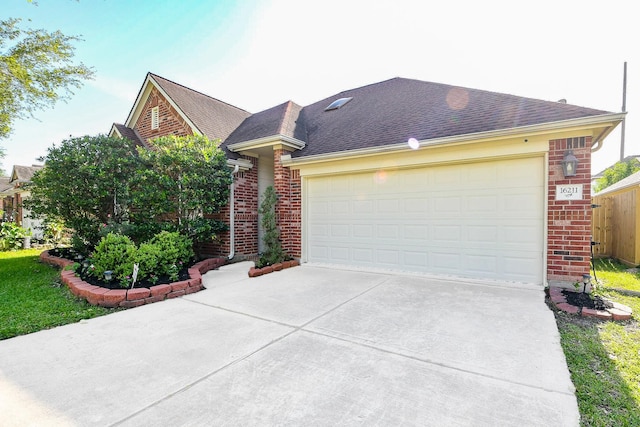 16211 Fleethaven Ln, Houston, TX 77084 - view of front of property featuring brick siding, concrete driveway, and an attached garage