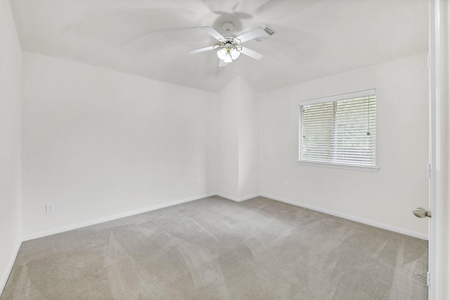 unfurnished room featuring carpet, ceiling fan, and baseboards