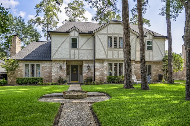 6111 Knollview Dr, Spring, TX 77389 - tudor-style house with stucco siding and a front lawn