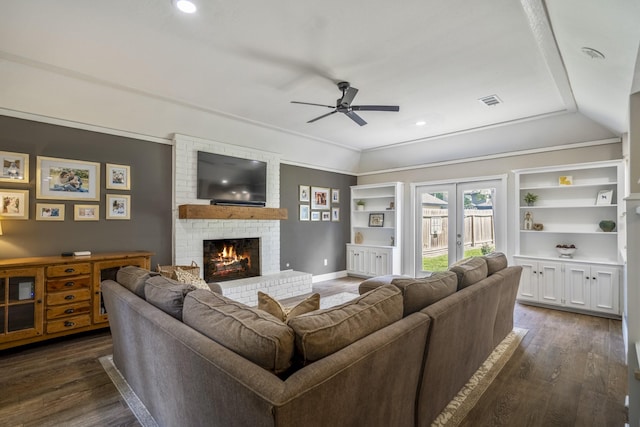 6111 Knollview Dr, Spring, TX 77389 - living room featuring a ceiling fan, dark wood-type flooring, a brick fireplace, baseboards, and vaulted ceiling