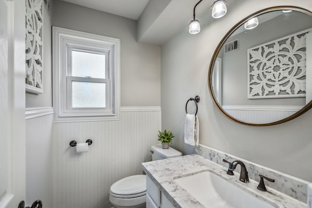 6111 Knollview Dr, Spring, TX 77389 - bathroom featuring a wainscoted wall, toilet, and vanity