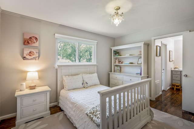 6111 Knollview Dr, Spring, TX 77389 - bedroom with dark wood-style floors, ornamental molding, a chandelier, and baseboards