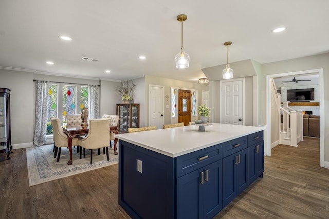 6111 Knollview Dr, Spring, TX 77389 - kitchen with blue cabinetry, baseboards, recessed lighting, dark wood-style floors, and light countertops