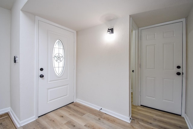 7227 La Granada Dr, Houston, TX 77083 - entryway featuring light wood-style floors and baseboards