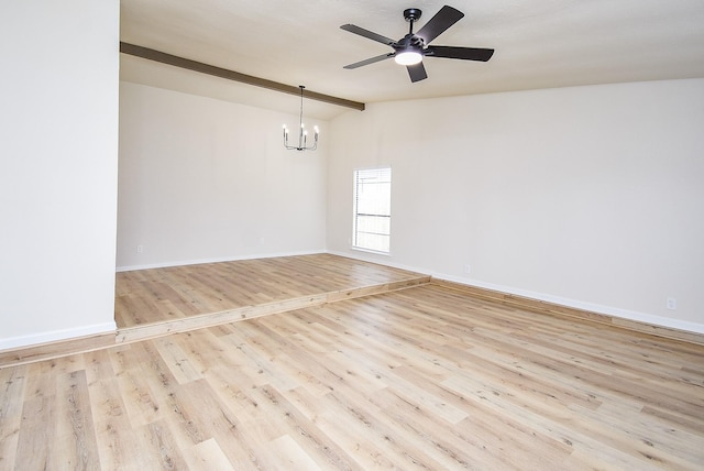 7227 La Granada Dr, Houston, TX 77083 - spare room with a chandelier, vaulted ceiling, wood finished floors, a ceiling fan, and baseboards