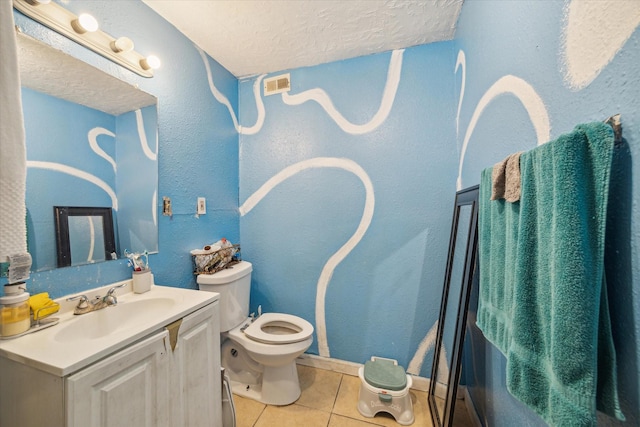 6702 England St, Houston, TX 77021 - bathroom featuring tile patterned floors, a textured ceiling, toilet, vanity, and baseboards
