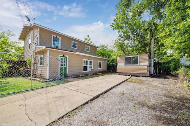 6702 England St, Houston, TX 77021 - rear view of house with fence, an outdoor structure, a patio area, and concrete driveway