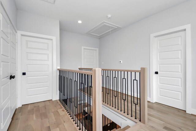 1217 Cabell St, Houston, TX 77022 - corridor with attic access, wood finished floors, an upstairs landing, and recessed lighting