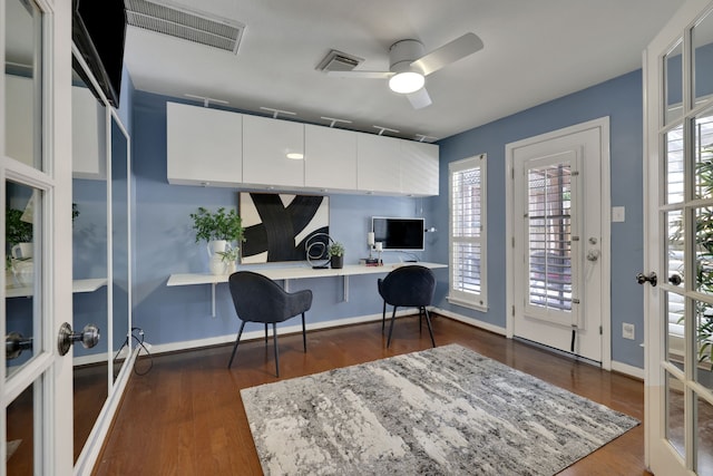 2416 Charleston St Unit E, Houston, TX 77021 - office area with a ceiling fan, dark wood-style flooring, baseboards, and built in desk