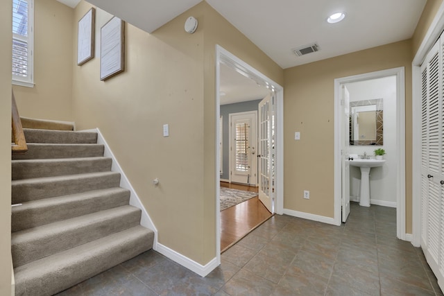 2416 Charleston St Unit E, Houston, TX 77021 - stairs featuring baseboards and recessed lighting