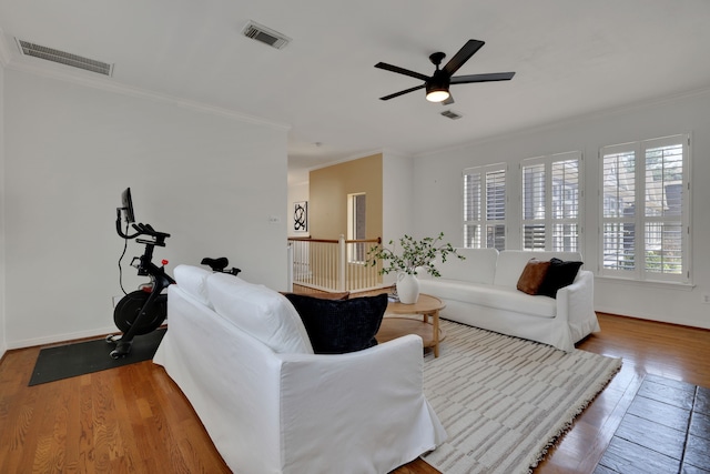 2416 Charleston St Unit E, Houston, TX 77021 - living room featuring wood finished floors, ceiling fan, crown molding, and baseboards