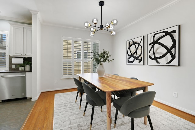 2416 Charleston St Unit E, Houston, TX 77021 - dining room with ornamental molding, wood finished floors, a chandelier, and baseboards