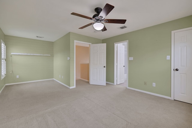 2416 Charleston St Unit E, Houston, TX 77021 - unfurnished bedroom featuring carpet floors, baseboards, and a ceiling fan