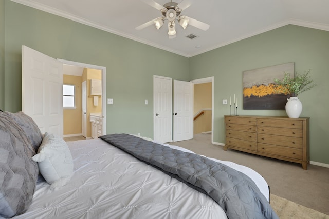 2416 Charleston St Unit E, Houston, TX 77021 - bedroom with carpet flooring, baseboards, connected bathroom, crown molding, and ceiling fan