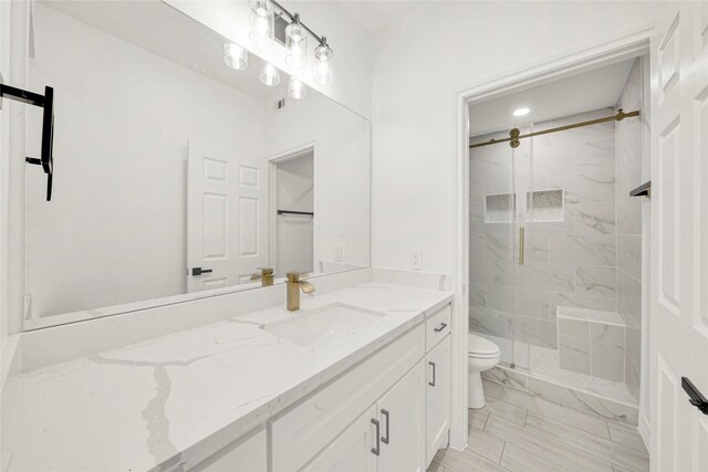 6037 S Acres Dr, Houston, TX 77048 - bathroom featuring toilet, a stall shower, vanity, and marble finish flooring