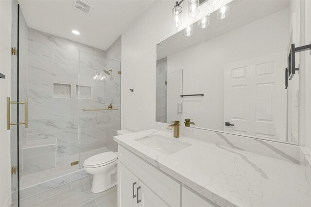 6037 S Acres Dr, Houston, TX 77048 - full bathroom featuring toilet, a marble finish shower, vanity, and recessed lighting