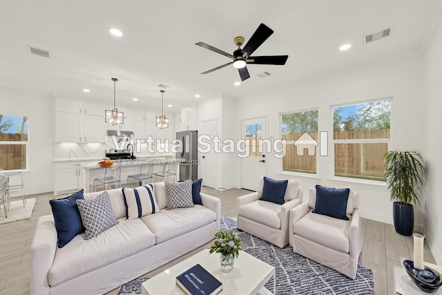 6037 S Acres Dr, Houston, TX 77048 - living room with recessed lighting, a ceiling fan, baseboards, and light wood-style flooring