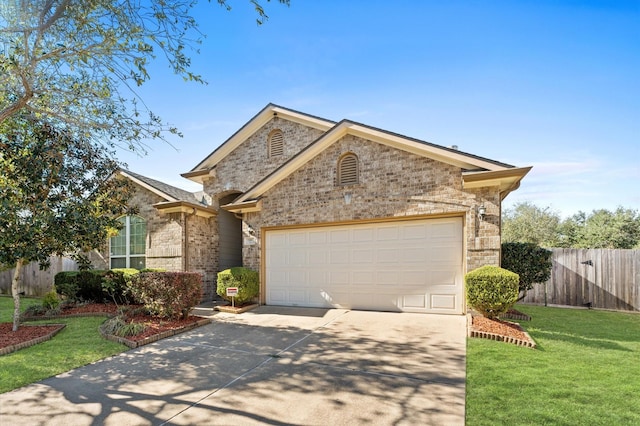 7303 Enchanted Rock Ln, Missouri City, TX 77459 - view of front of home with concrete driveway, brick siding, and an attached garage