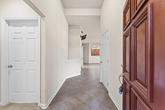 7303 Enchanted Rock Ln, Missouri City, TX 77459 - foyer featuring baseboards and tile patterned flooring