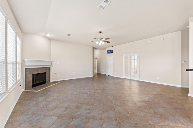 7303 Enchanted Rock Ln, Missouri City, TX 77459 - unfurnished living room featuring a ceiling fan, a fireplace, and baseboards