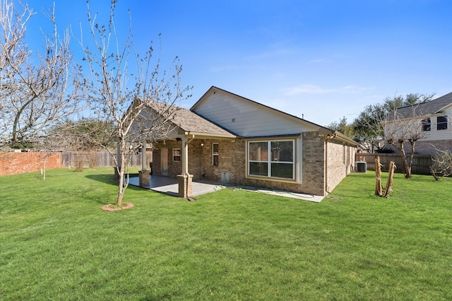 7303 Enchanted Rock Ln, Missouri City, TX 77459 - rear view of house with a patio area and brick siding