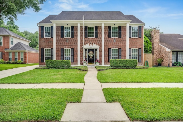 2641 Sawyer Dr, Seabrook, TX 77586 - view of front of house featuring a front yard and brick siding