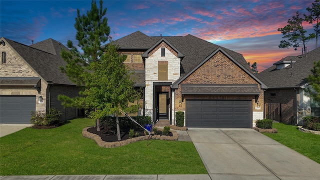 4325 Victoria Pine Dr, Spring, TX 77386 - french country inspired facade featuring driveway, a garage, a lawn, and brick siding