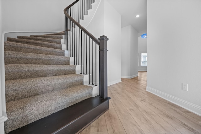 4325 Victoria Pine Dr, Spring, TX 77386 - staircase with wood finished floors, baseboards, and recessed lighting