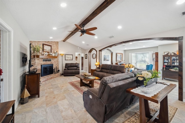 96 Fm 2550th Rd, Huntsville, TX 77320 - living area featuring a brick fireplace, arched walkways, a ceiling fan, and recessed lighting
