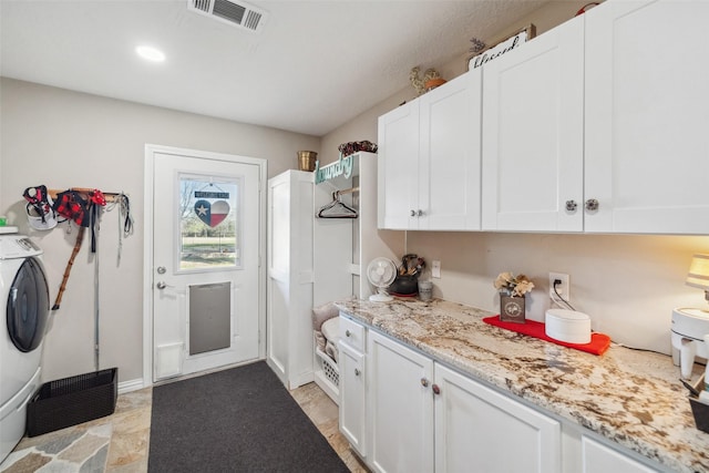 96 Fm 2550th Rd, Huntsville, TX 77320 - laundry area with cabinet space and washer / clothes dryer