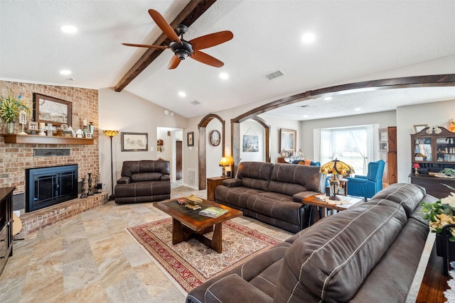 96 Fm 2550th Rd, Huntsville, TX 77320 - living room with arched walkways, ceiling fan, recessed lighting, a brick fireplace, and stone finish flooring