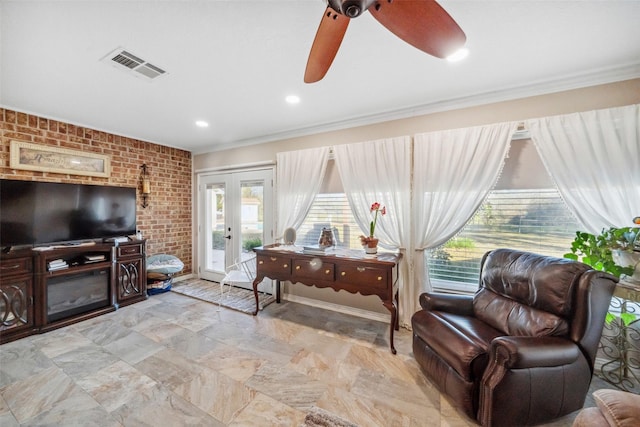 96 Fm 2550th Rd, Huntsville, TX 77320 - living room featuring brick wall, healthy amount of natural light, crown molding, ceiling fan, and french doors