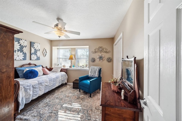 96 Fm 2550th Rd, Huntsville, TX 77320 - bedroom with a textured ceiling and ceiling fan
